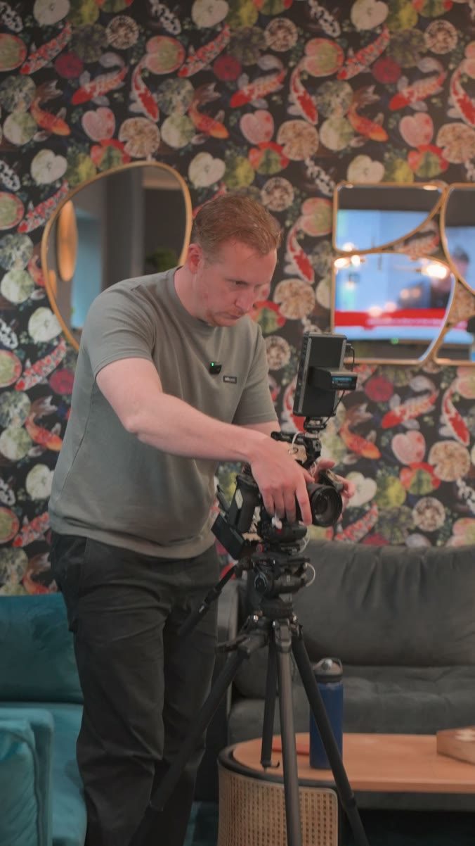 Sam setting up a camera on a shoot