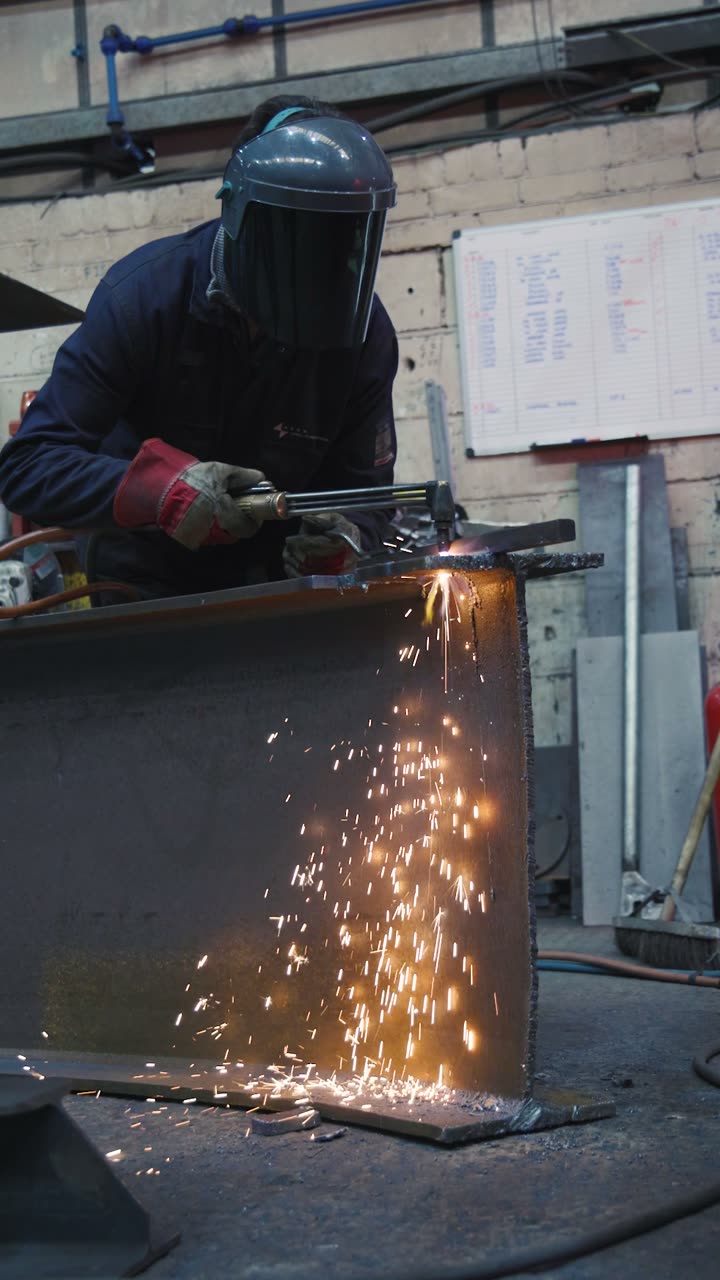 Cranes, plate and flame cutting in a steel fabrication workshop