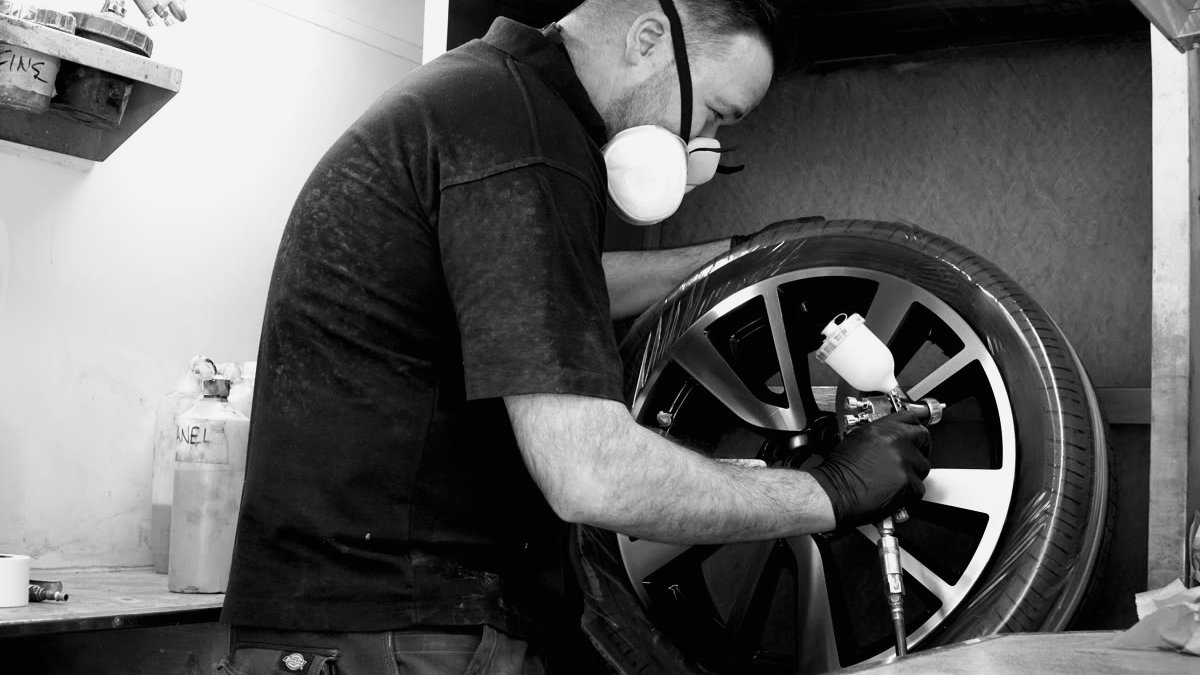 Spraying a wheel in the Alloy Logic booth