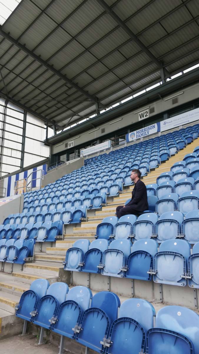 Between takes in the stands at a football ground