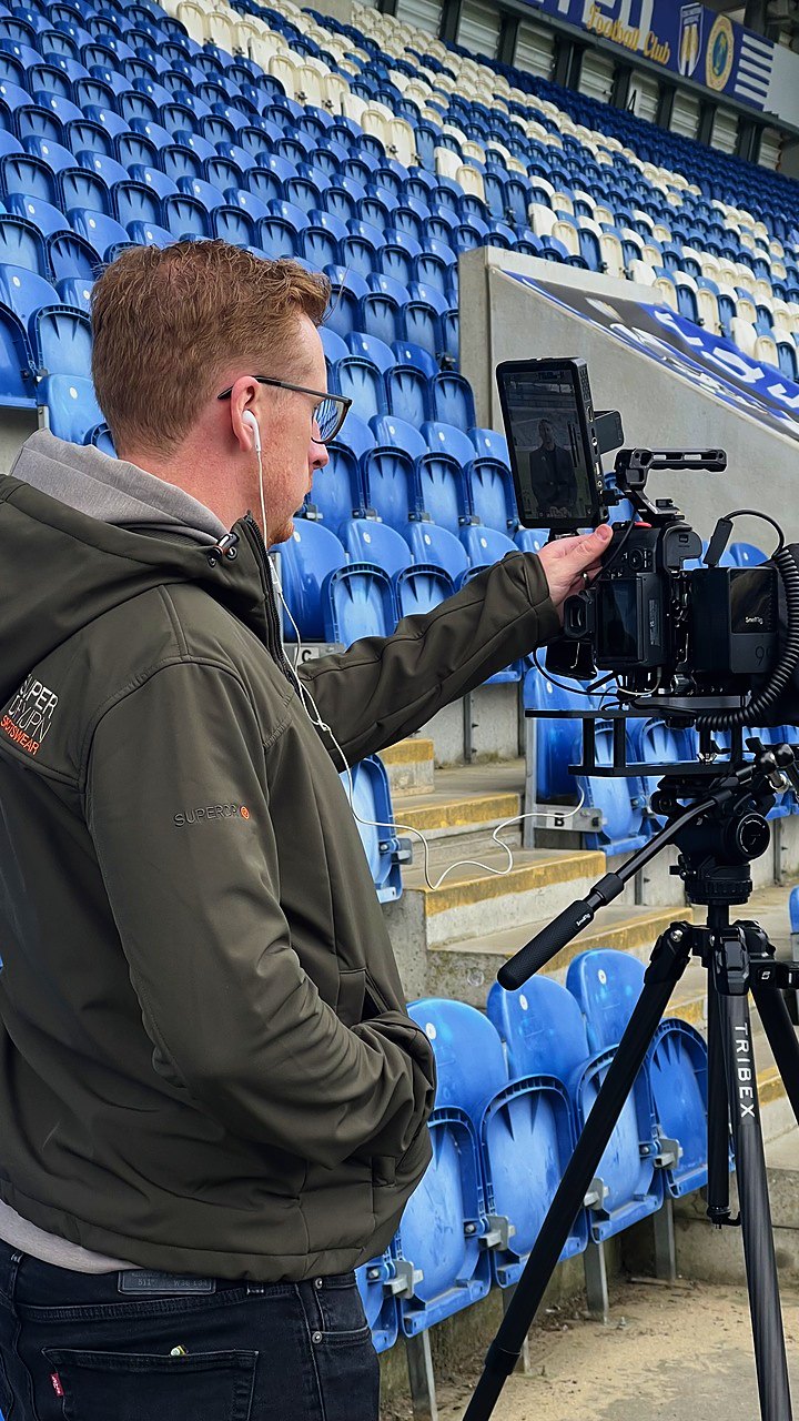 Checking the frame on a stadium shoot