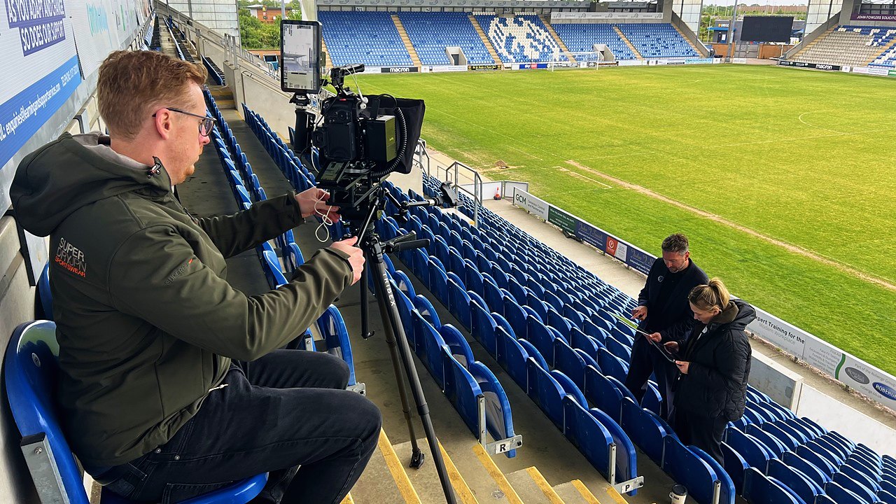Setting up the shot in the stands