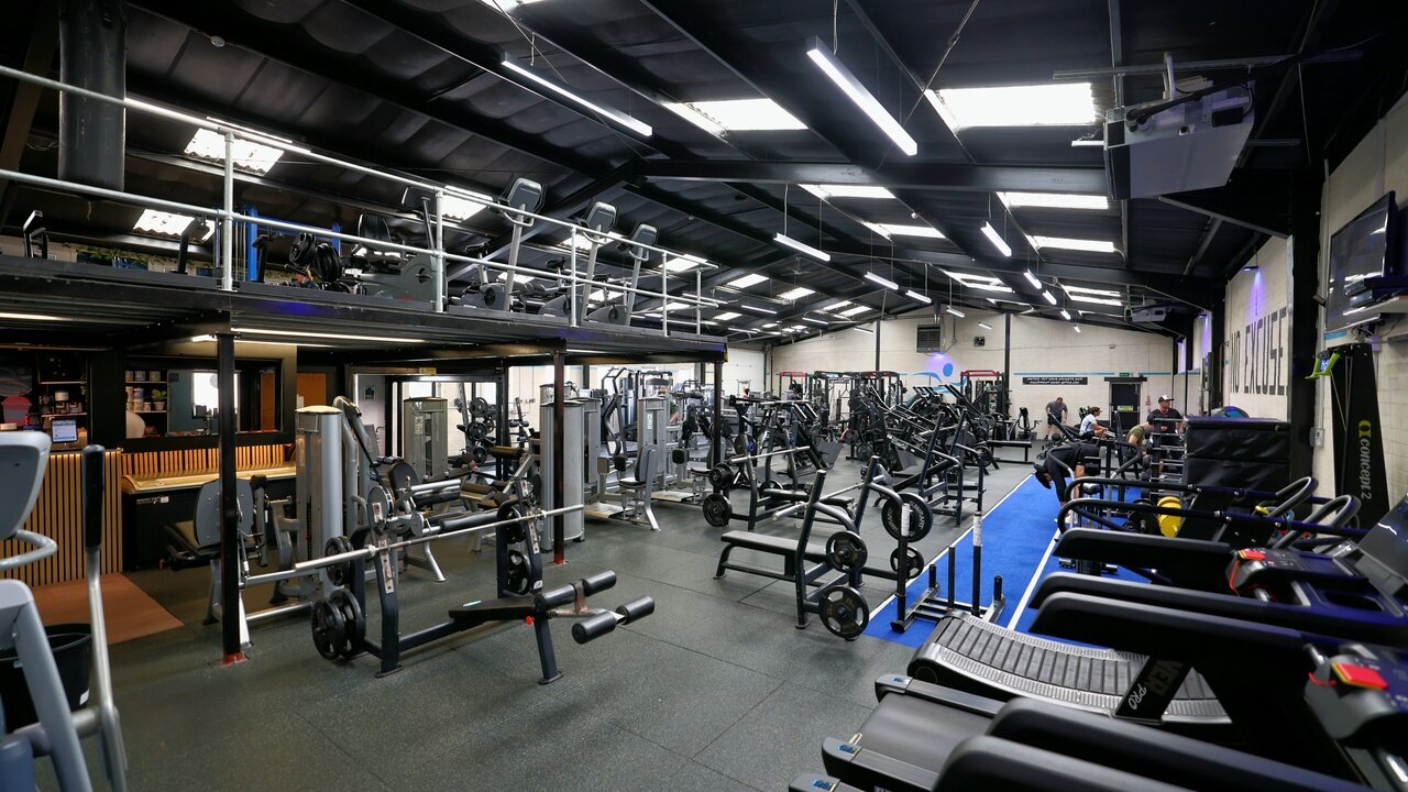 A wide view of the gym floor from the mezzanine end