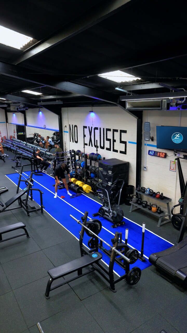 The No Excuses wall and blue track at Leman’s Gym