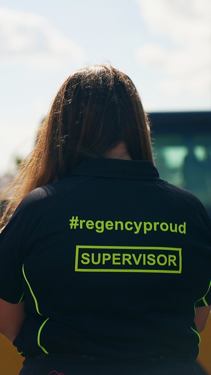 The back of a Regency Security supervisor’s polo reading #regencyproud