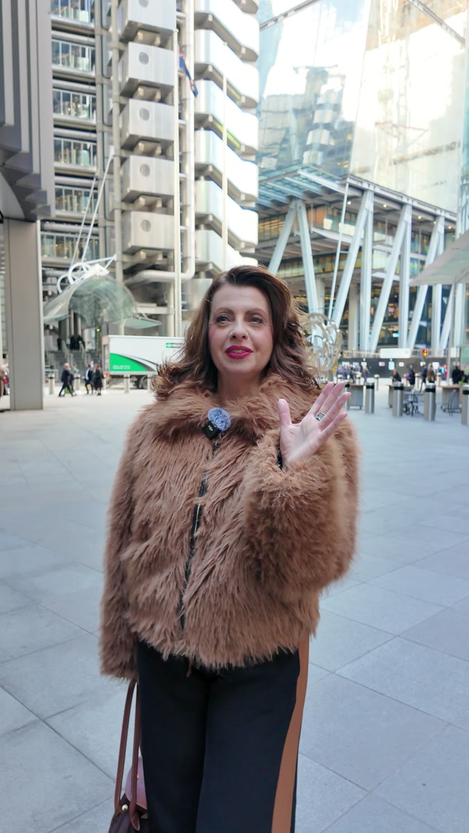 Liz Flavell presenting to camera near the Lloyd&rsquo;s building in the City