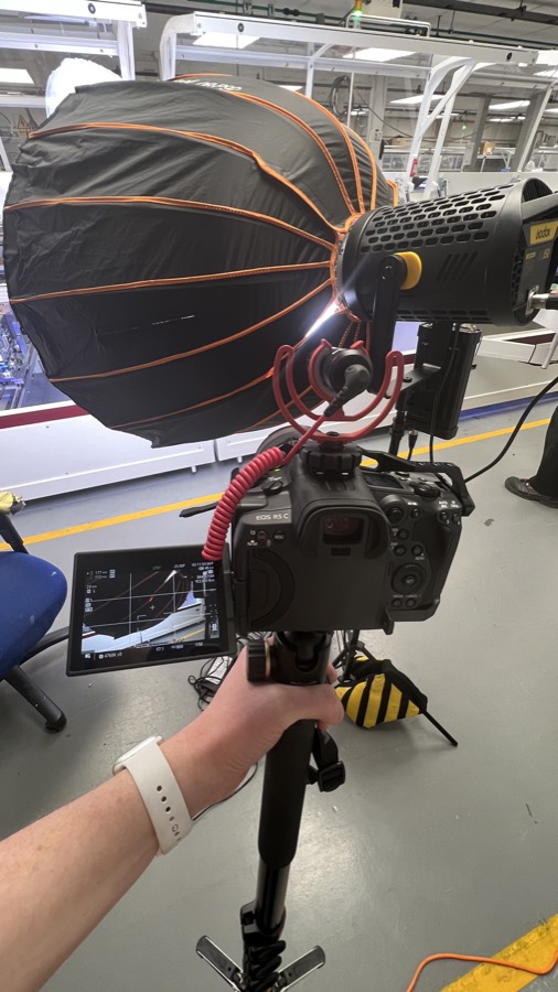 Filming on location in a manufacturing facility
