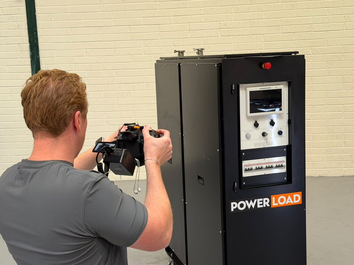 Over Sam’s shoulder as he frames a PowerLoad cabinet with a camera in the factory