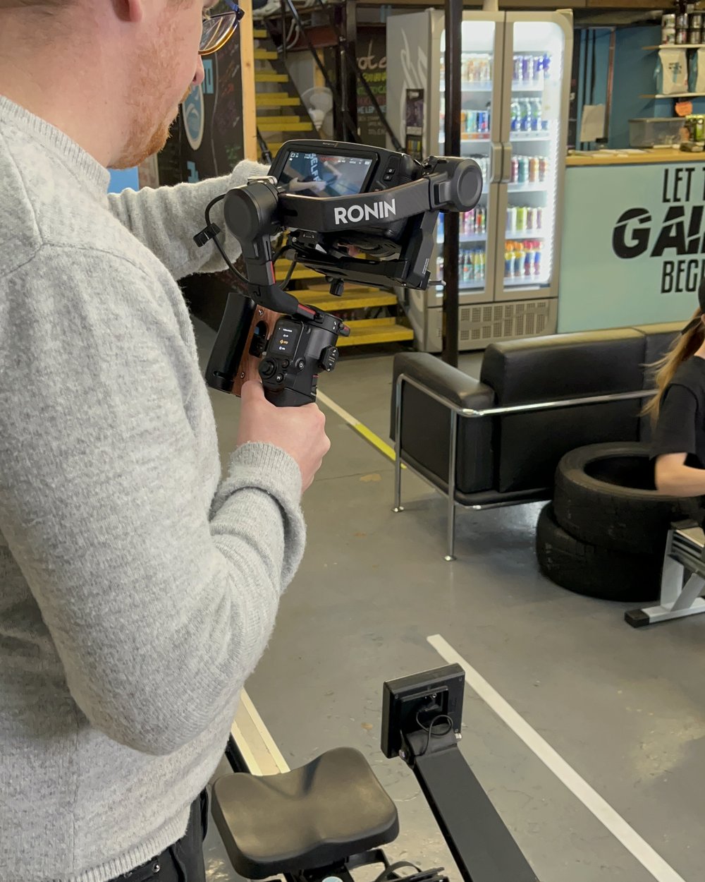 A member of our crew shooting on a gimbal on a gym floor