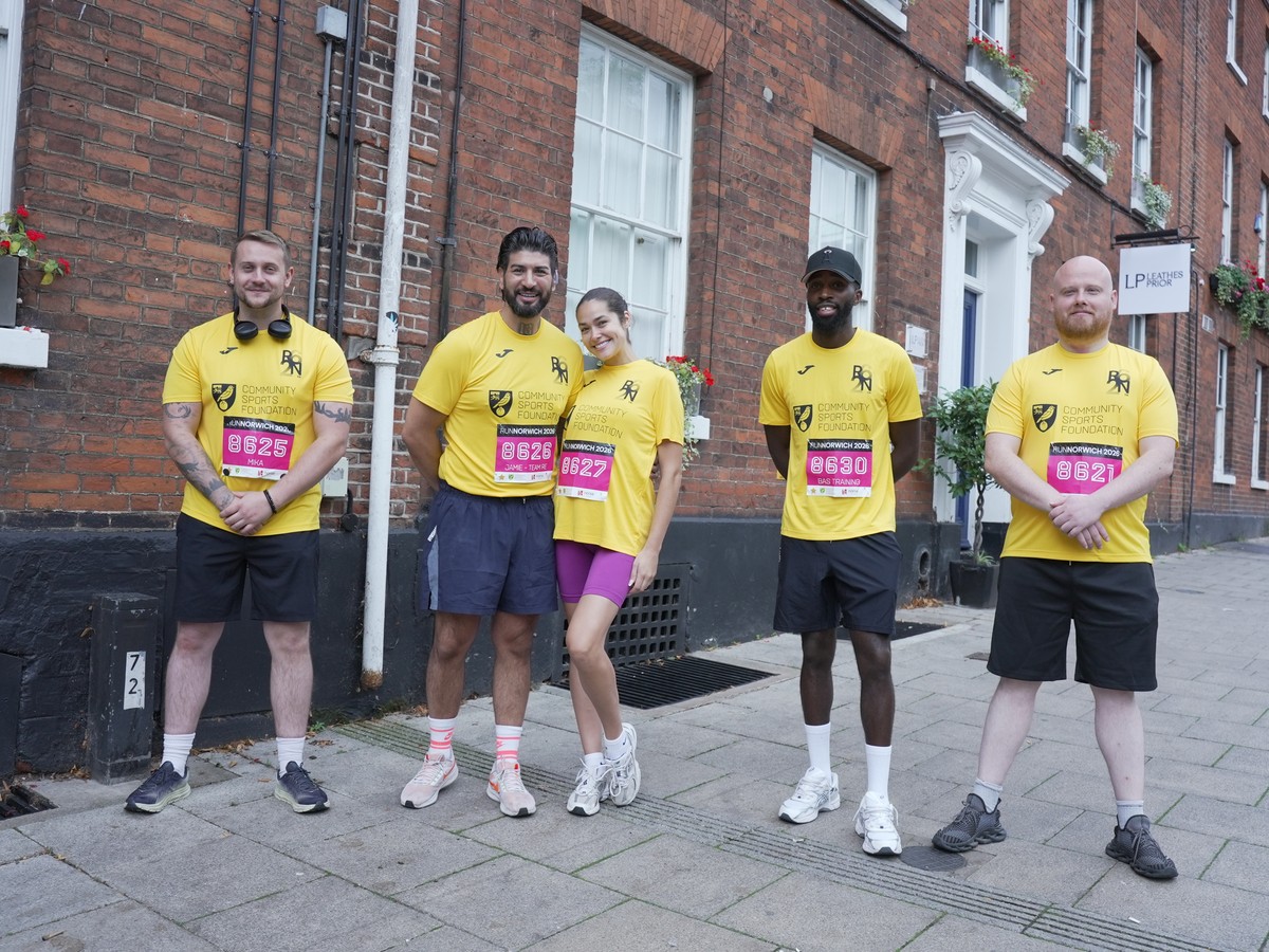 The Regency Security team in yellow Run Norwich shirts on a Norwich street