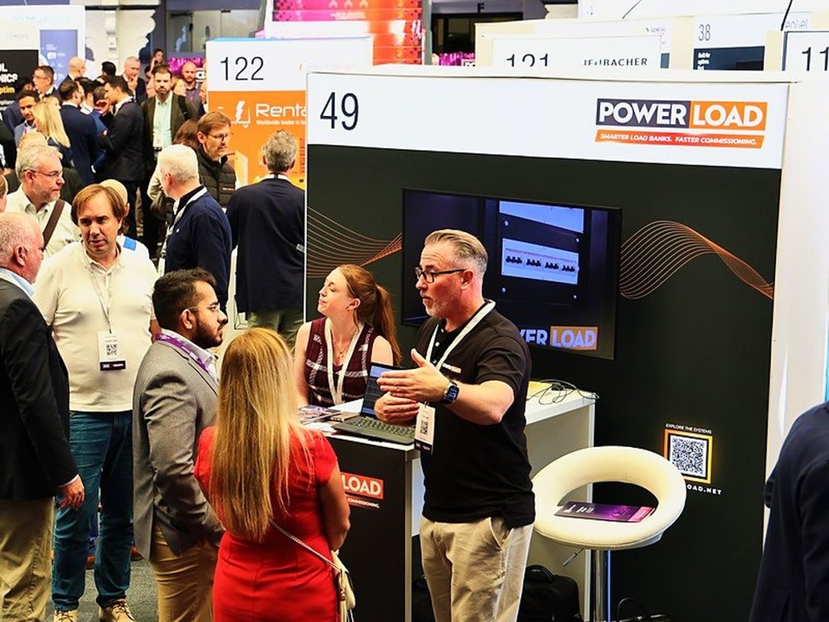 A busy PowerLoad stand at DCD Connect London with visitors talking to the team